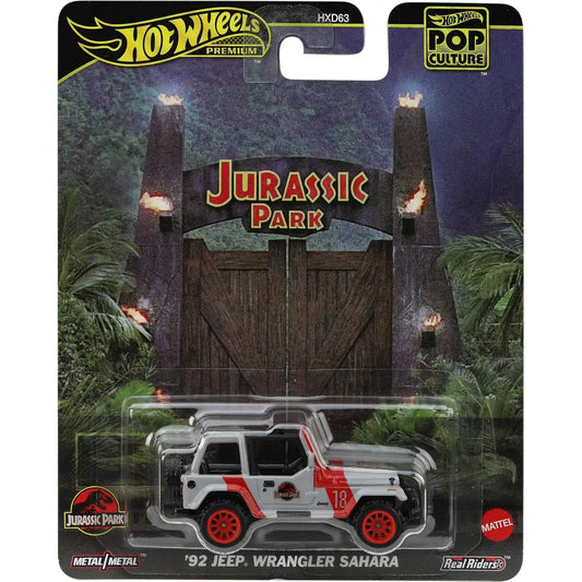 Hot Wheels Premium Pop Culture Jurassic Park '92 Jeep Wrangler Sahara die-cast model with red wheels and movie-accurate detailing.