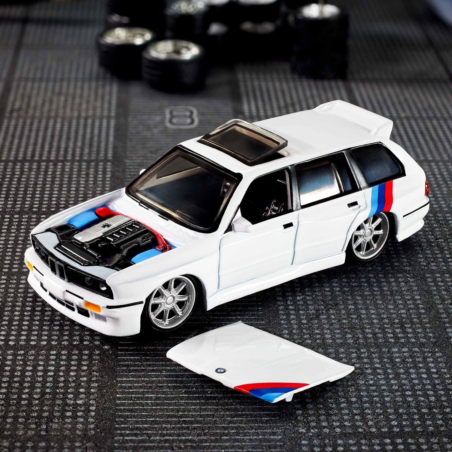 Hot Wheels Elite 64 die-cast model of the 1990 BMW 318i Touring with S54 swap and custom racing details.