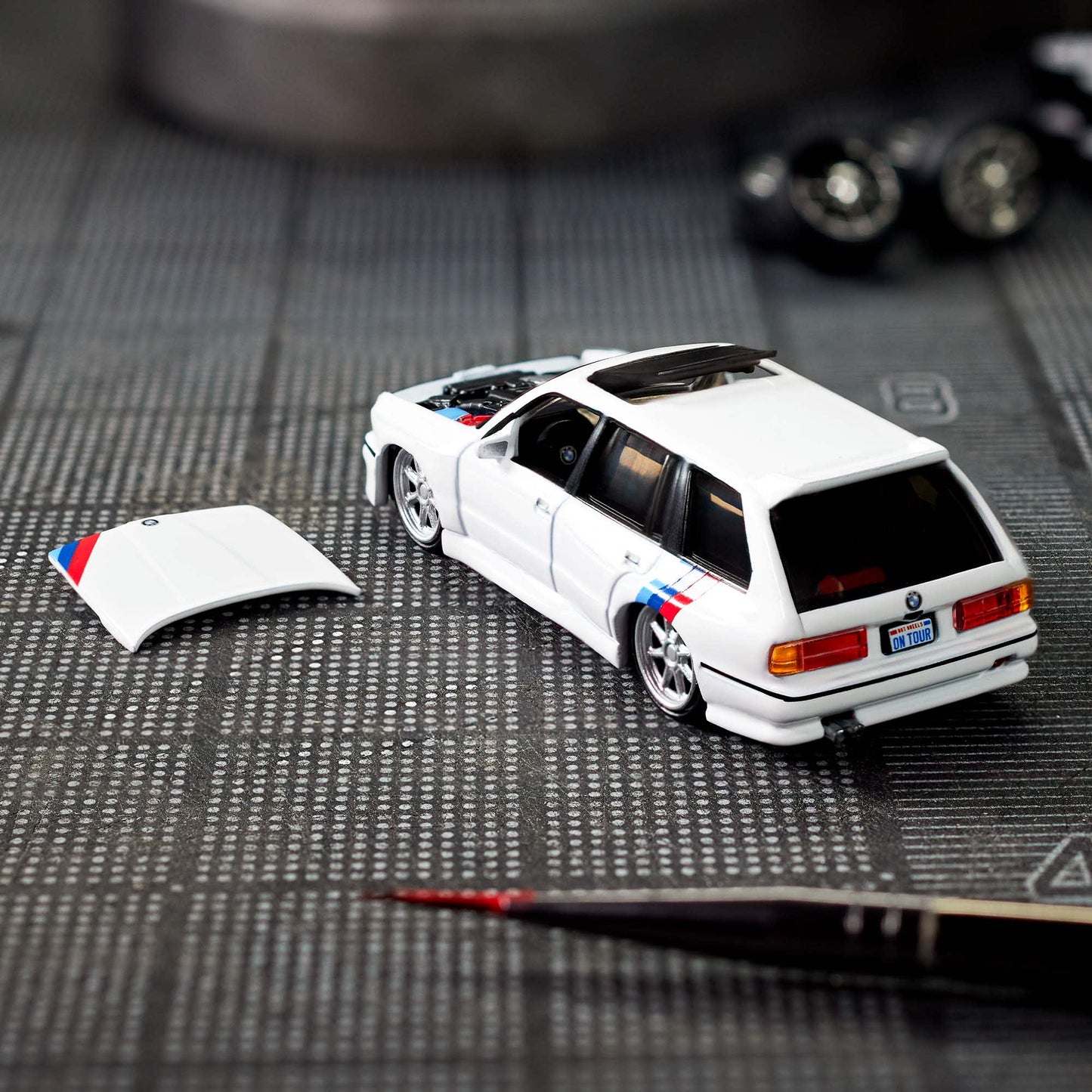 Hot Wheels Elite 64 die-cast model of the 1990 BMW 318i Touring with S54 swap and custom racing details.