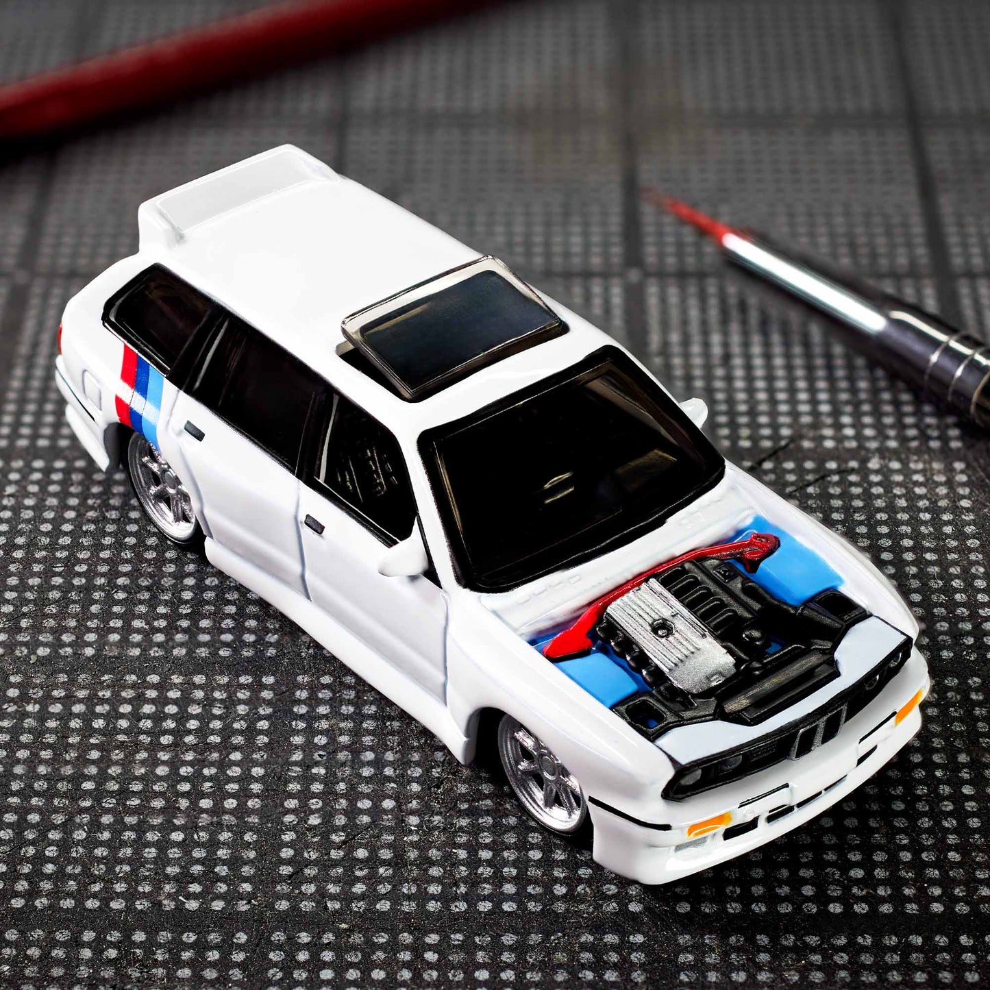 Hot Wheels Elite 64 die-cast model of the 1990 BMW 318i Touring with S54 swap and custom racing details.