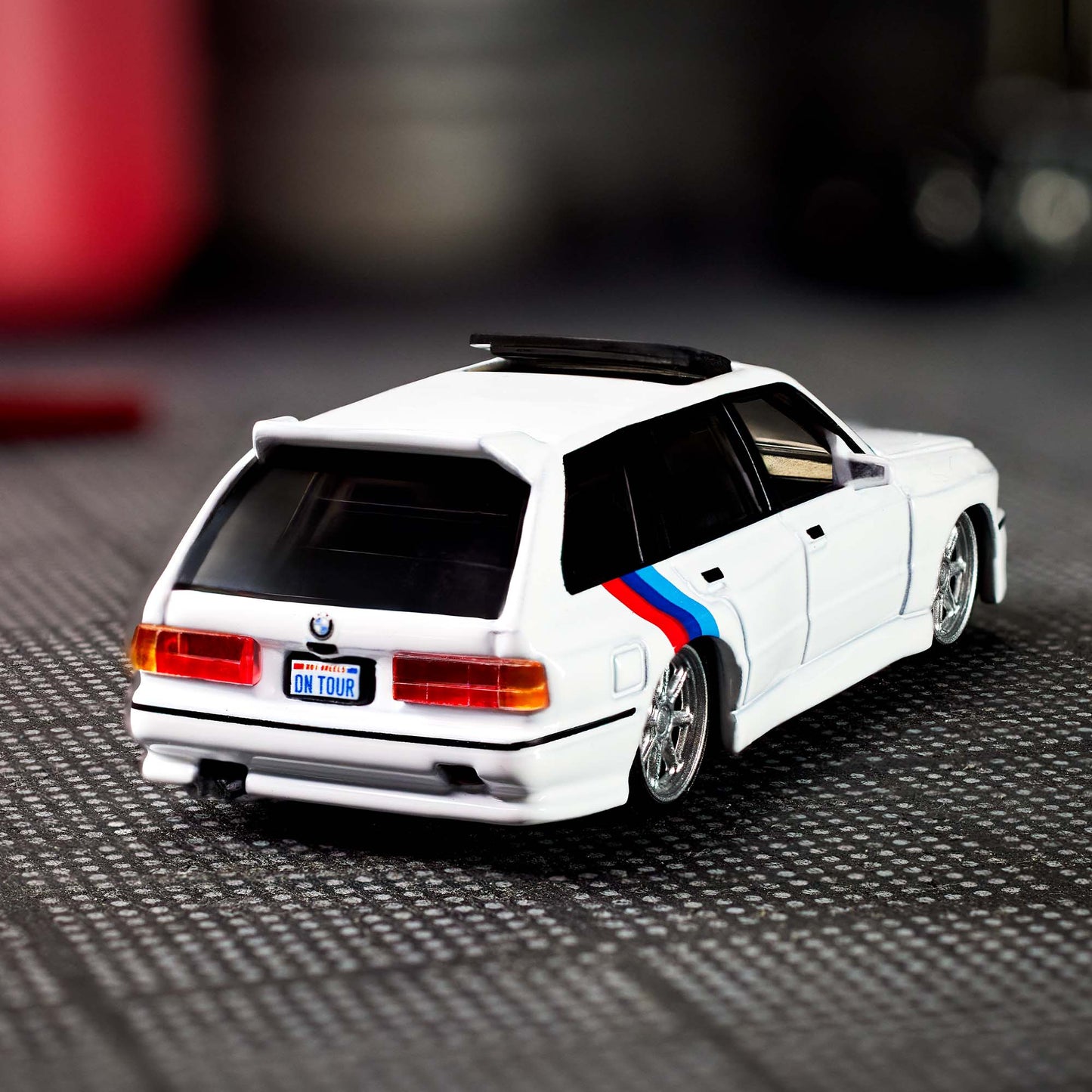Hot Wheels Elite 64 die-cast model of the 1990 BMW 318i Touring with S54 swap and custom racing details.