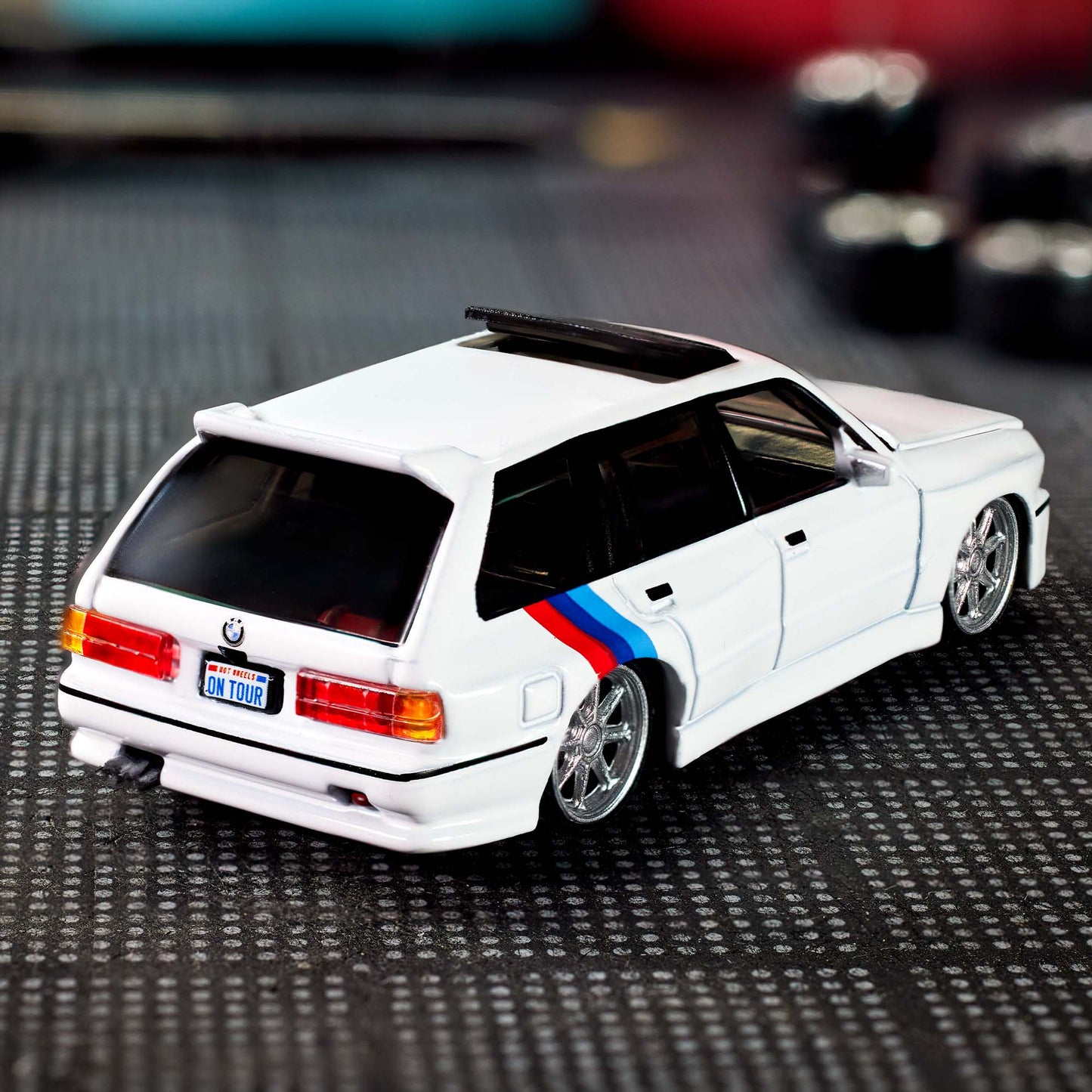 Hot Wheels Elite 64 die-cast model of the 1990 BMW 318i Touring with S54 swap and custom racing details.