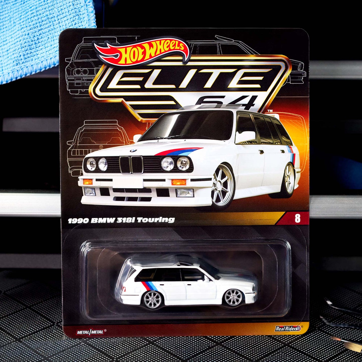 Hot Wheels Elite 64 die-cast model of the 1990 BMW 318i Touring with S54 swap and custom racing details.