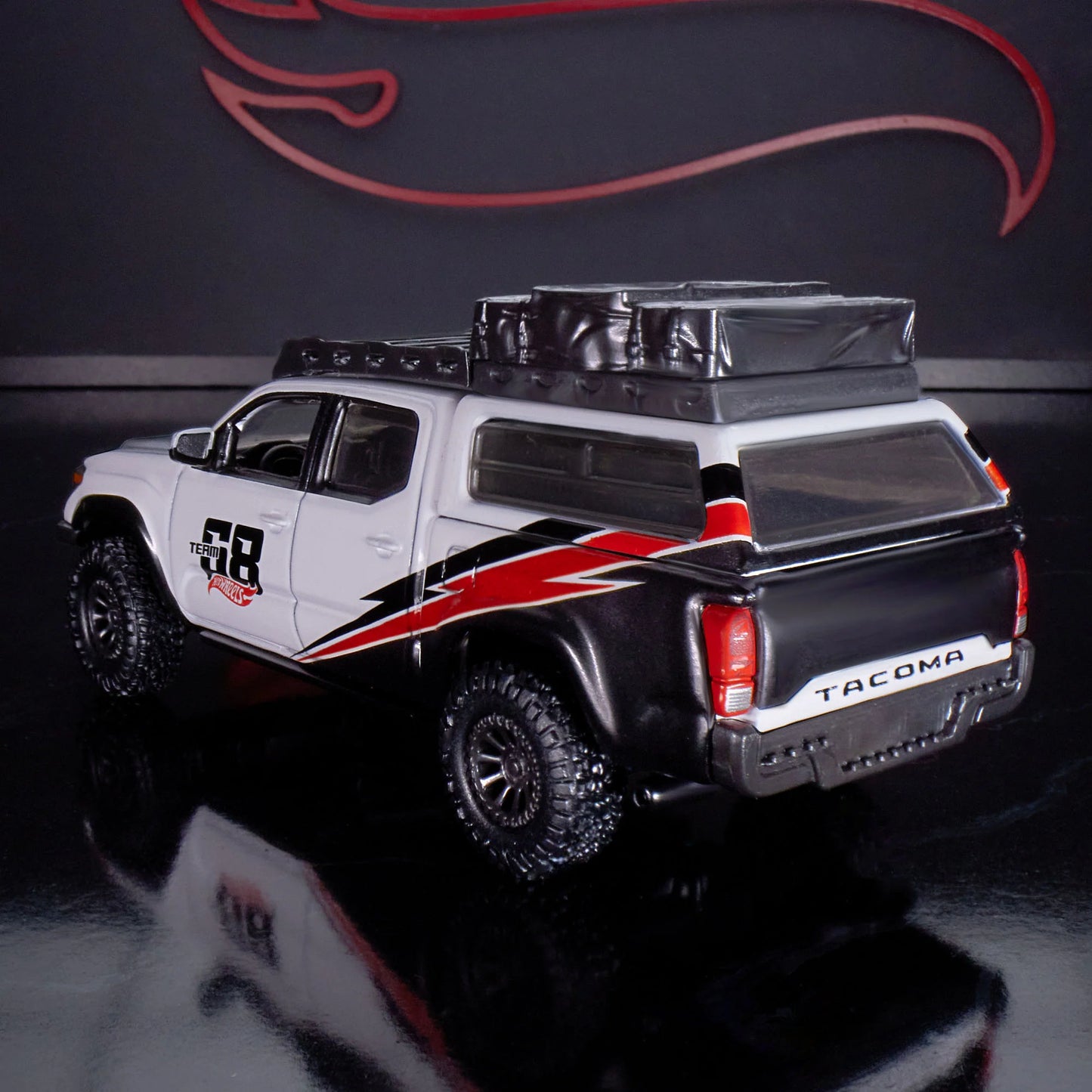 Hot Wheels Elite 64 Mod Shop die-cast 2017 Toyota Tacoma in solid gloss white with off-road accessories, model HNJ64.