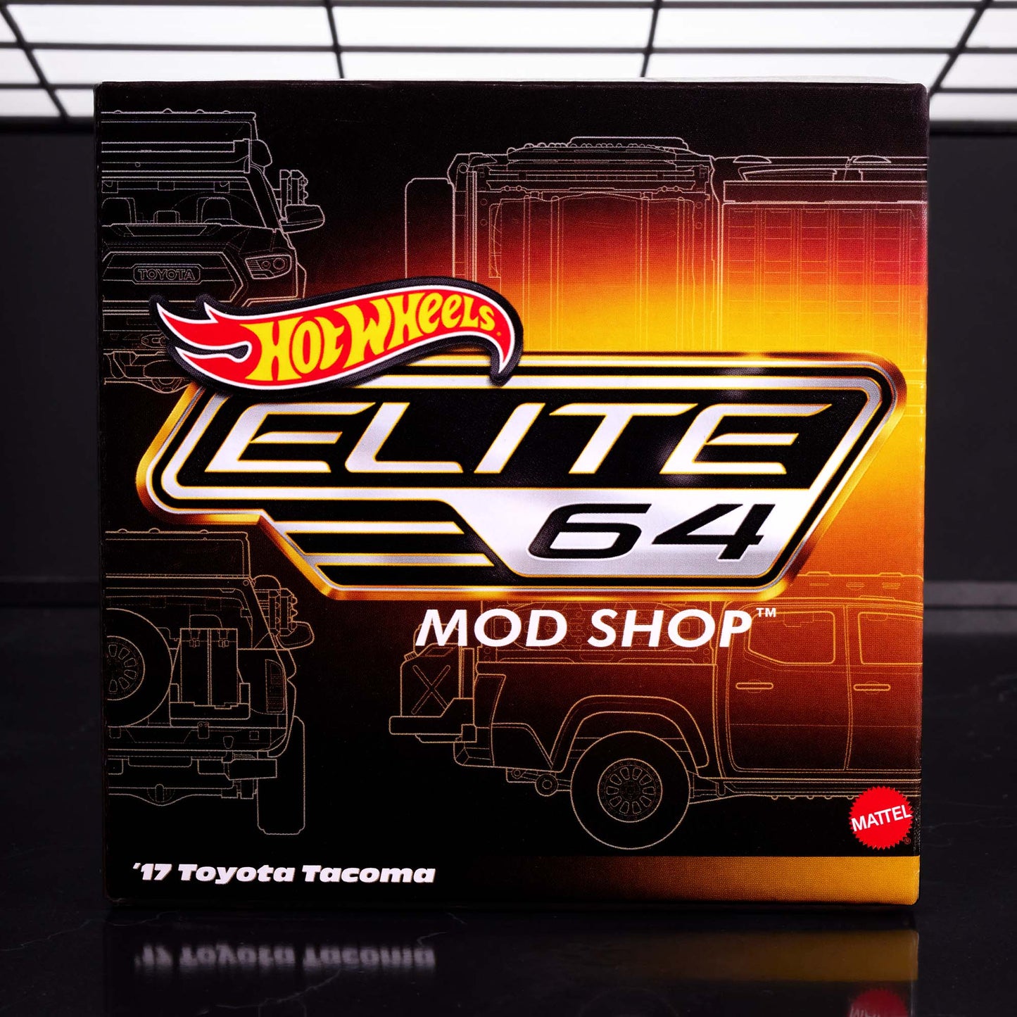 Hot Wheels Elite 64 Mod Shop die-cast 2017 Toyota Tacoma in solid gloss white with off-road accessories, model HNJ64.