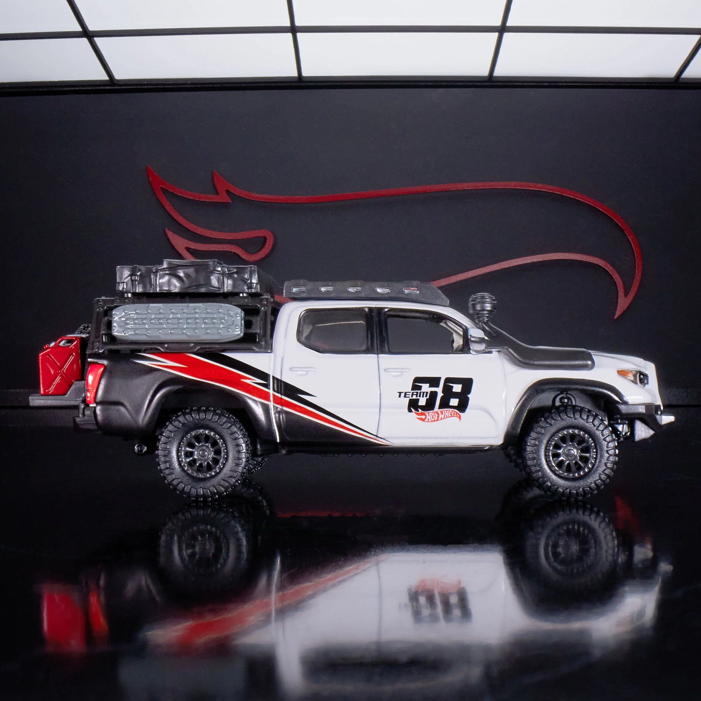 Hot Wheels Elite 64 Mod Shop die-cast 2017 Toyota Tacoma in solid gloss white with off-road accessories, model HNJ64.