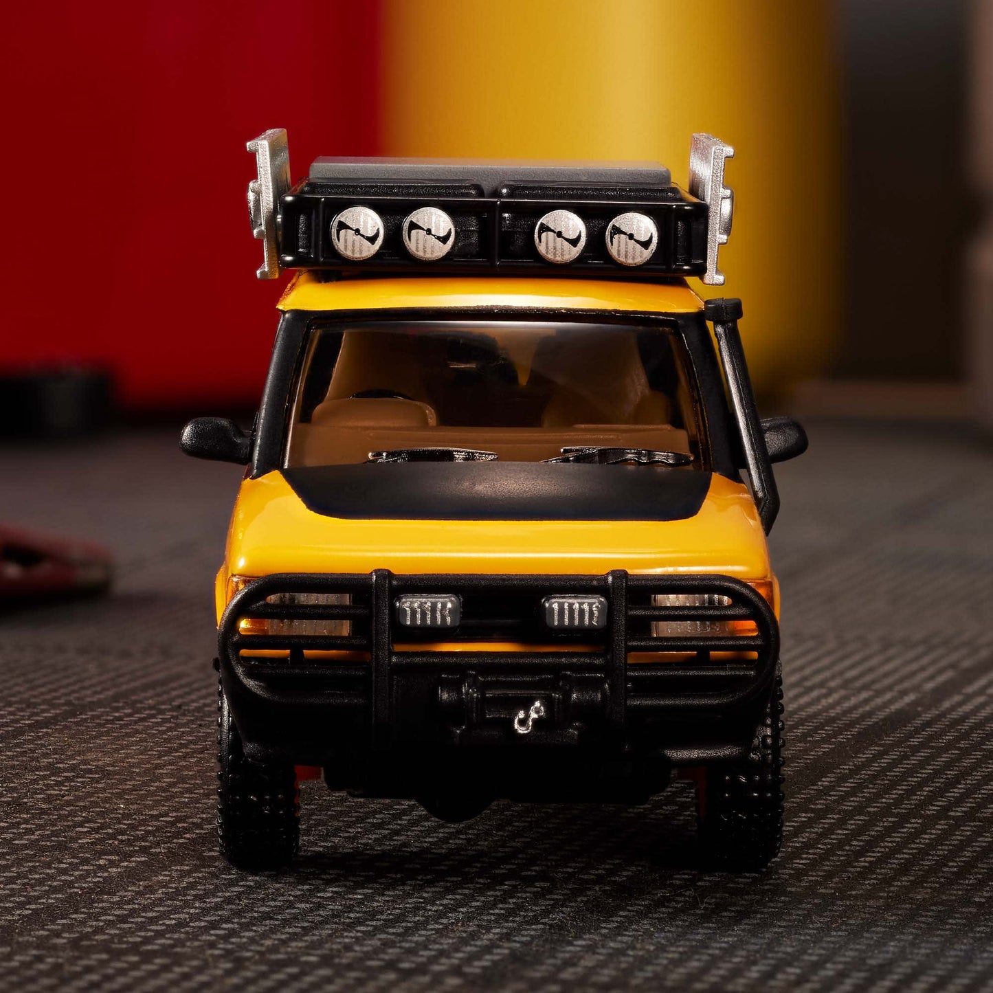 Hot Wheels Elite 64 Mod Shop 1994 Land Rover Discovery in yellow with dual wheel sets, model HNJ65