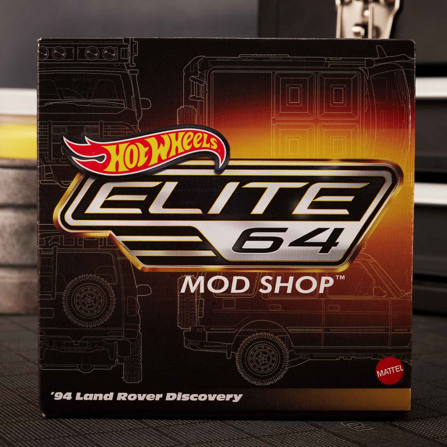 Hot Wheels Elite 64 Mod Shop 1994 Land Rover Discovery in yellow with dual wheel sets, model HNJ65