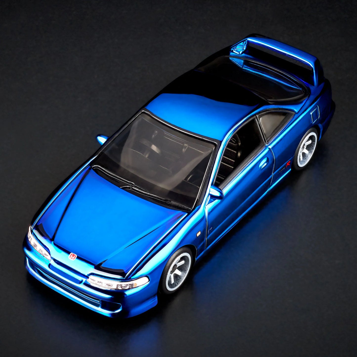 1:64 scale Hot Wheels RLC Exclusive 1995 Honda Integra Type R in Spectraflame OTTO Blue with hood open, showing detailed engine bay and Real Riders wheels. Includes RLC patch and button.