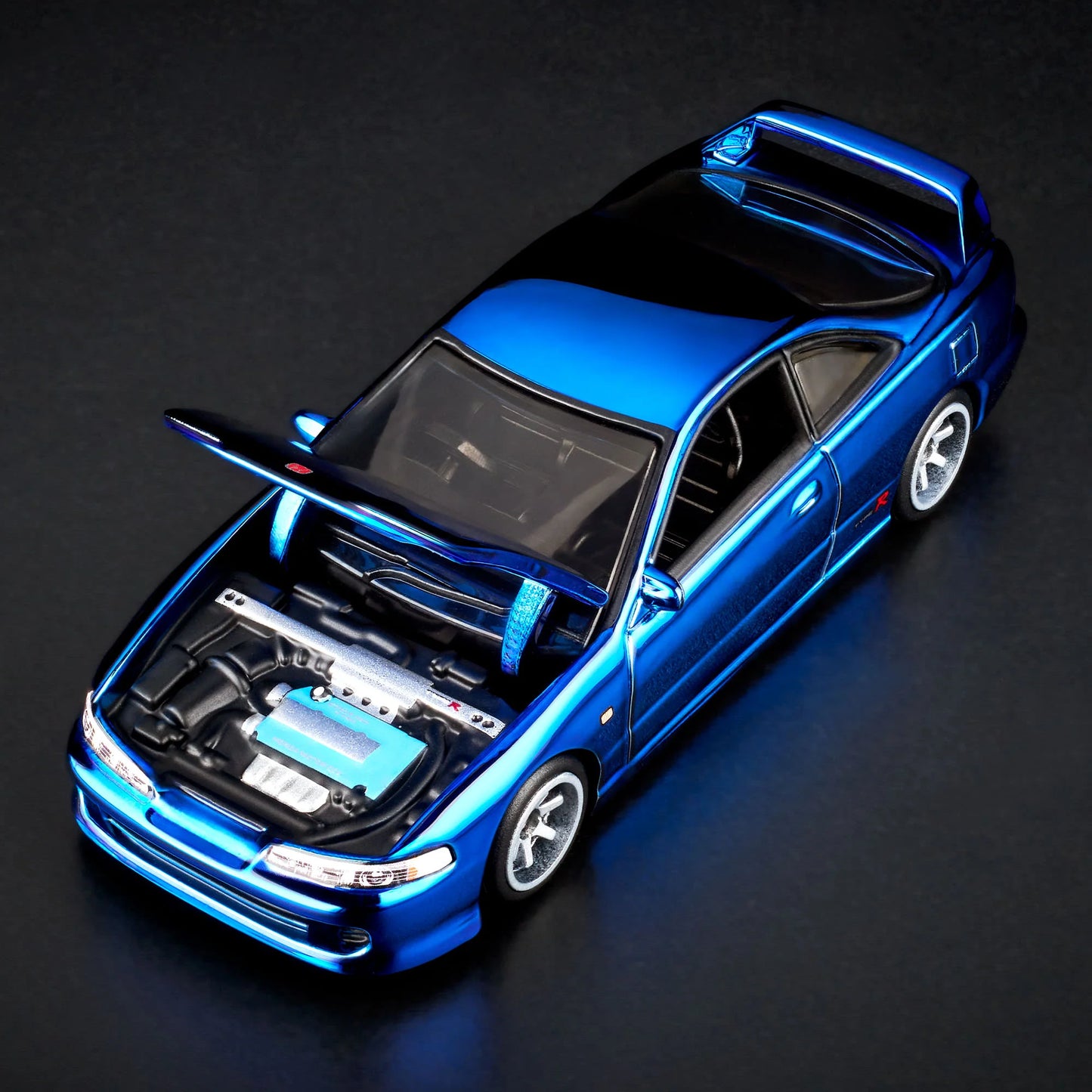1:64 scale Hot Wheels RLC Exclusive 1995 Honda Integra Type R in Spectraflame OTTO Blue with hood open, showing detailed engine bay and Real Riders wheels. Includes RLC patch and button.