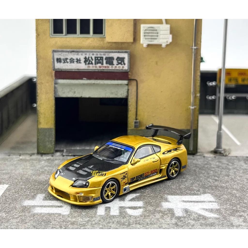 INNO64 1:64 scale die-cast Toyota Supra A80 GT300 in gold, tuned by Top Secret, model IN64-A80TS-GOLD