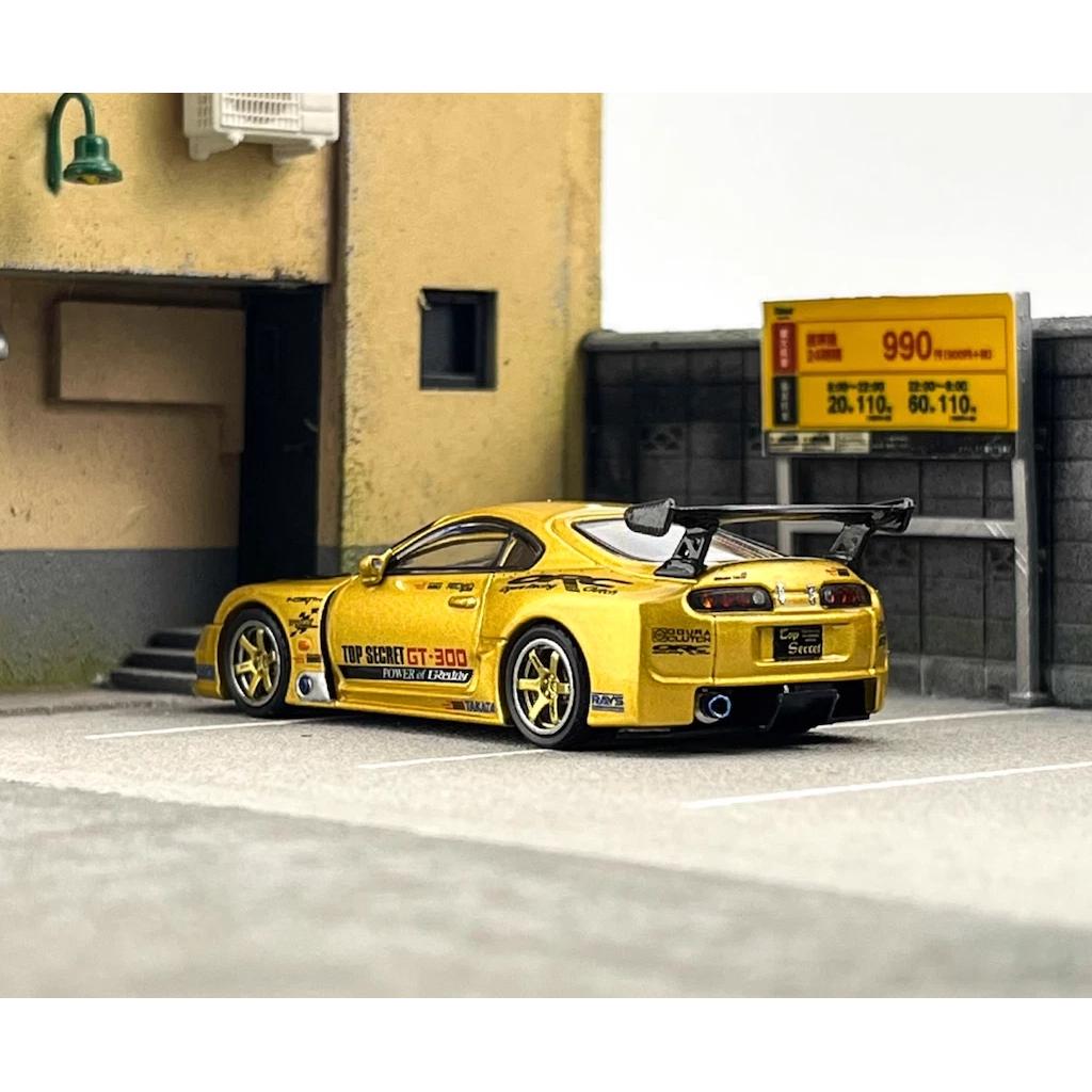 INNO64 1:64 scale die-cast Toyota Supra A80 GT300 in gold, tuned by Top Secret, model IN64-A80TS-GOLD.