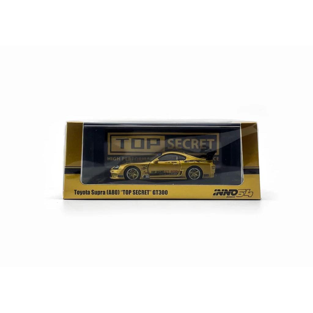 INNO64 1:64 scale die-cast Toyota Supra A80 GT300 in gold, tuned by Top Secret, model IN64-A80TS-GOLD.