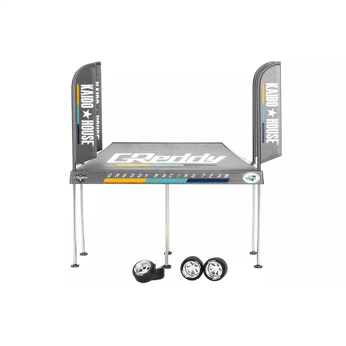 MiniGT Kaido House GReddy V1 Paddock Service Tent Set with Kaido House branding and bonus wheels, scale accessory for die-cast displays.