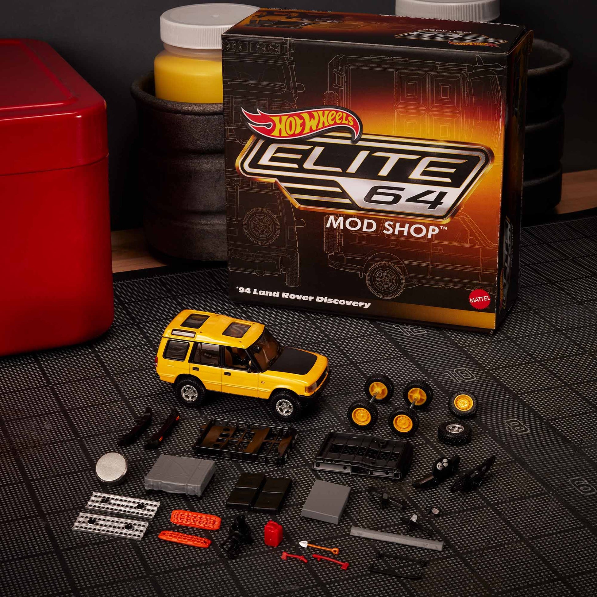 Hot Wheels Elite 64 Mod Shop 1994 Land Rover Discovery in yellow with dual wheel sets, model HNJ65