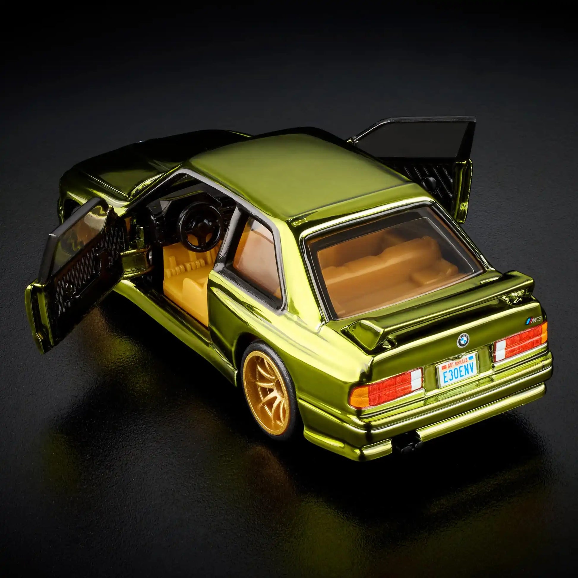 Hot Wheels RLC Exclusive 1991 BMW M3 in Spectraflame Olive with Real Riders gold 10-spoke wheels and opening doors.