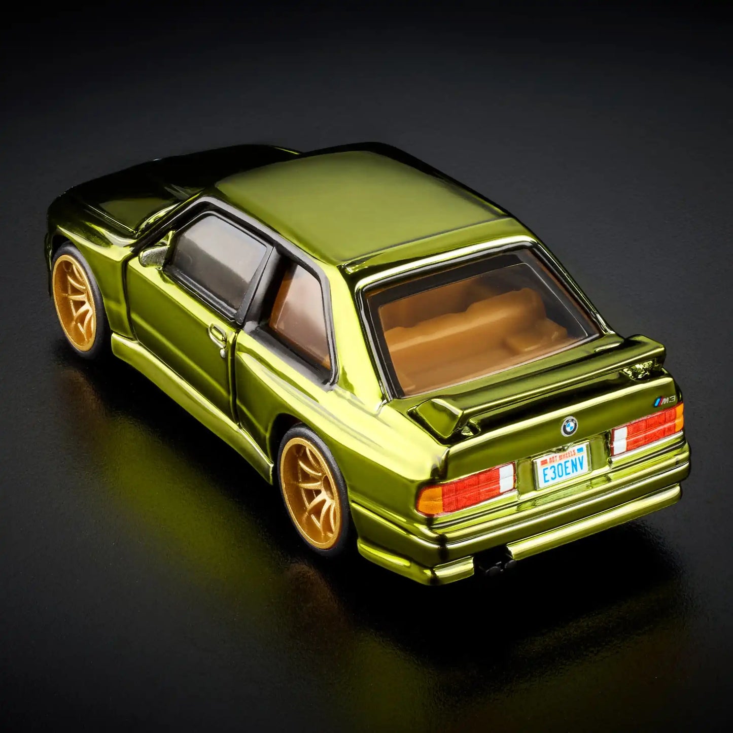 Hot Wheels RLC Exclusive 1991 BMW M3 in Spectraflame Olive with Real Riders gold 10-spoke wheels and opening doors.