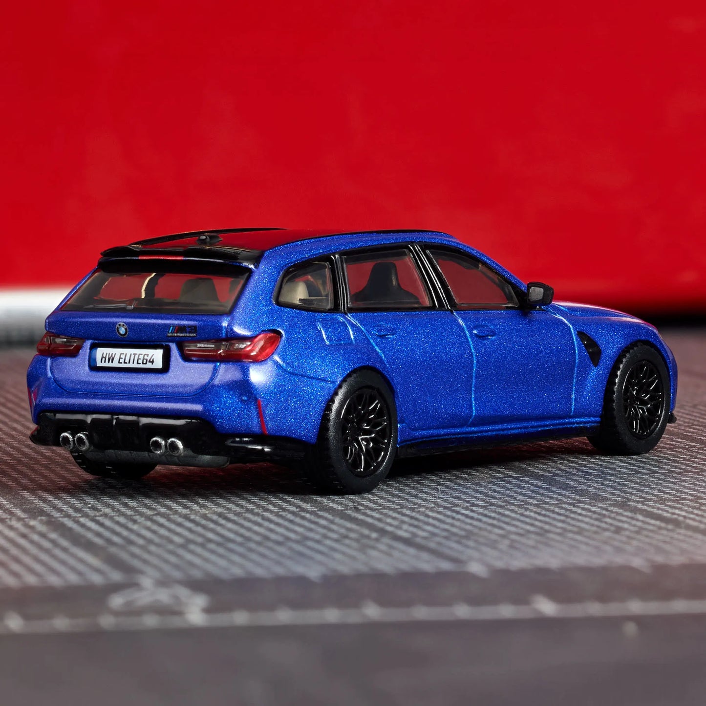 Hot Wheels Elite 64 BMW M3 Touring 1:64 scale die-cast model in Frozen Portimao Blue with Real Riders wheels