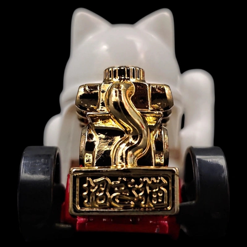 Hot Wheels 1:64 Feline Lucky die-cast car from the Celebration Racers series featuring a lucky cat design with gold accents.