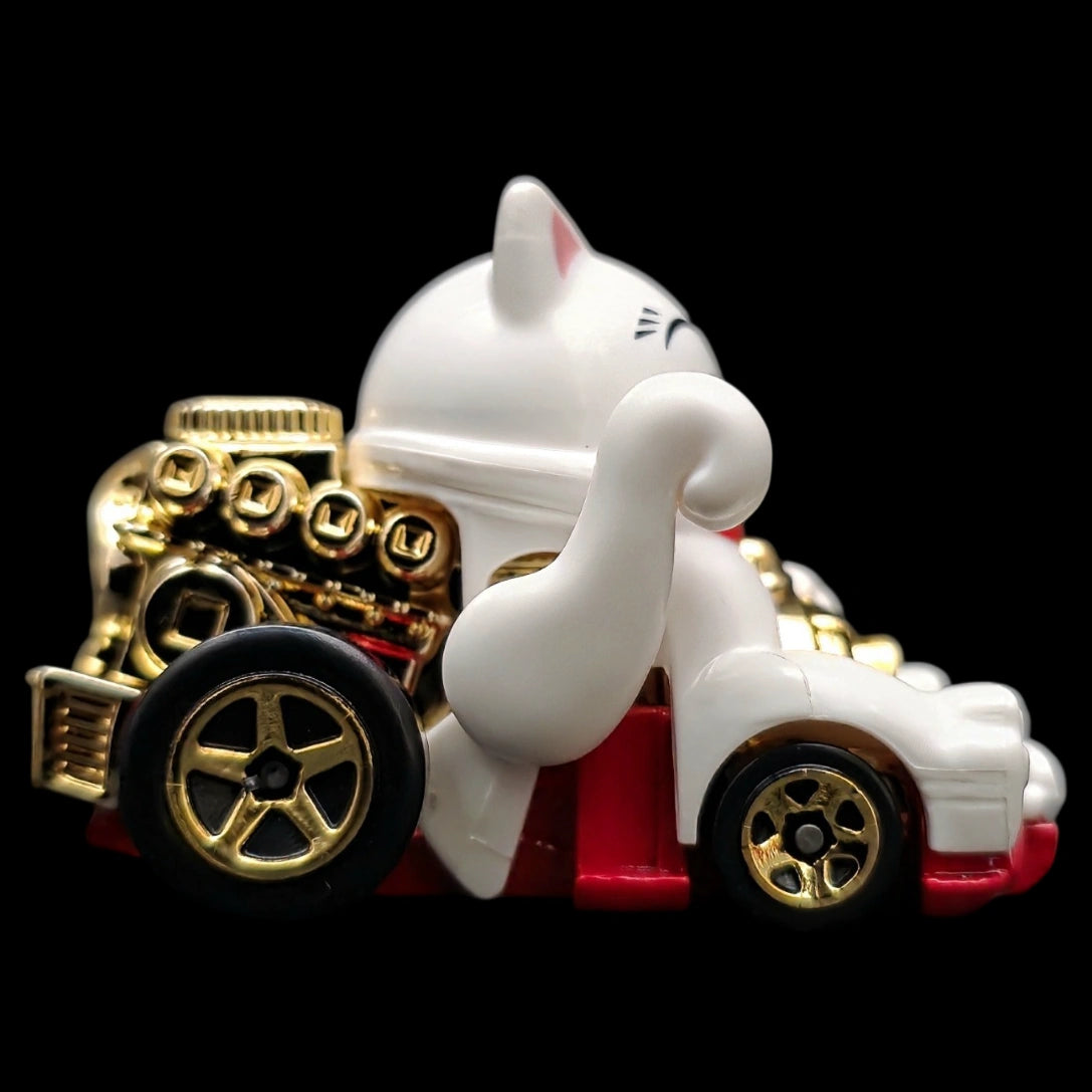Hot Wheels 1:64 Feline Lucky die-cast car from the Celebration Racers series featuring a lucky cat design with gold accents.