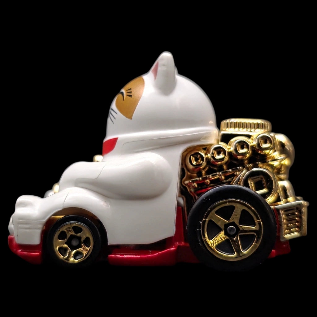 Hot Wheels 1:64 Feline Lucky die-cast car from the Celebration Racers series featuring a lucky cat design with gold accents.