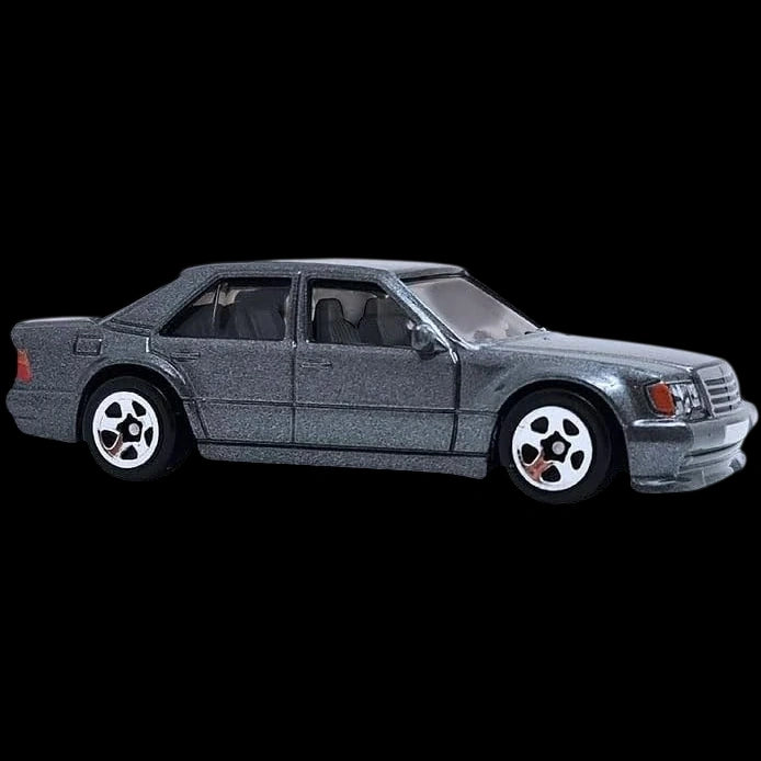 Hot Wheels 1:64 scale Mercedes-Benz 500 E die-cast model in gray from the 70s vs 90s series.