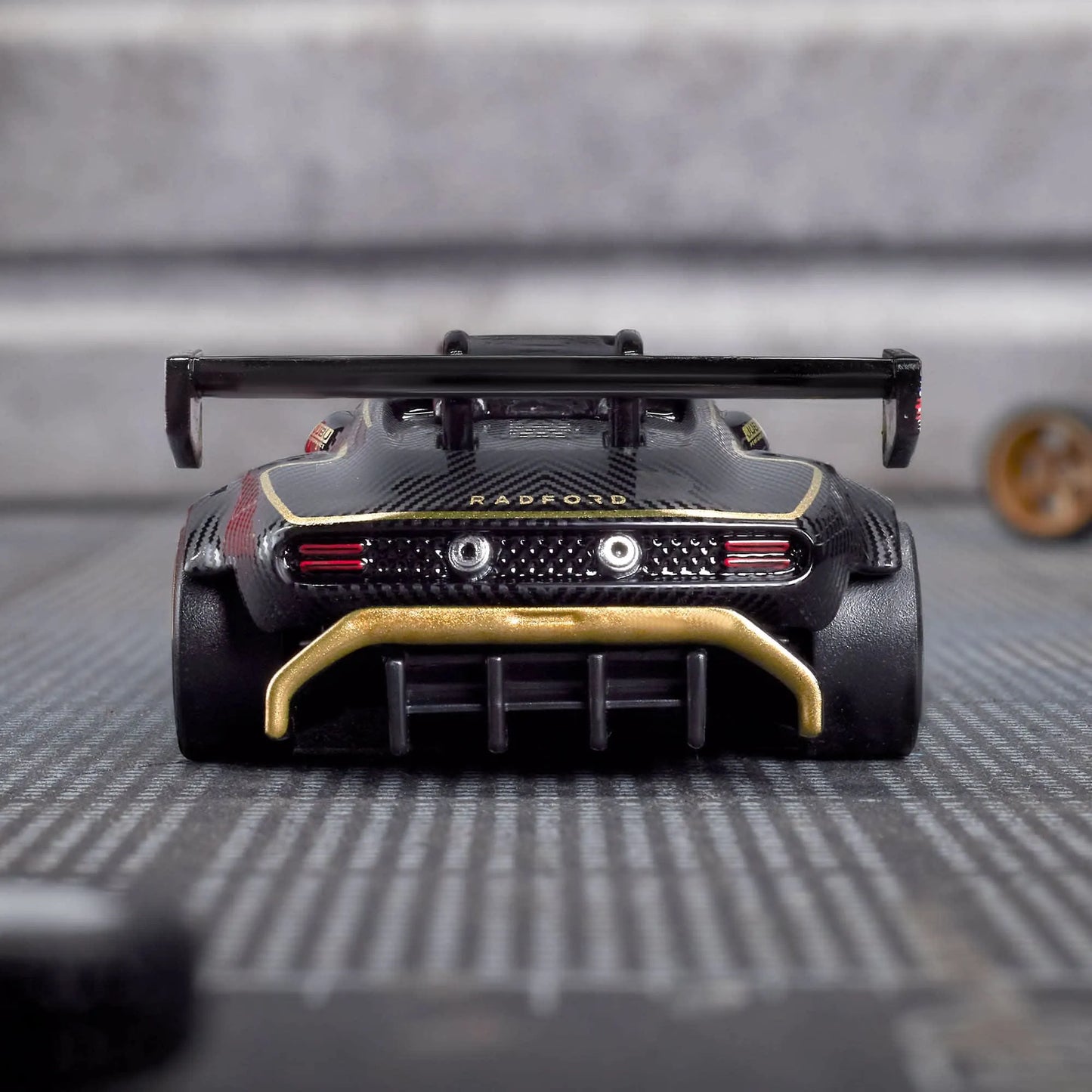 Hot Wheels Elite 64 Radford Type 62-2 Pikes Peak die-cast model with Real Riders wheels and black ZAMAC body.