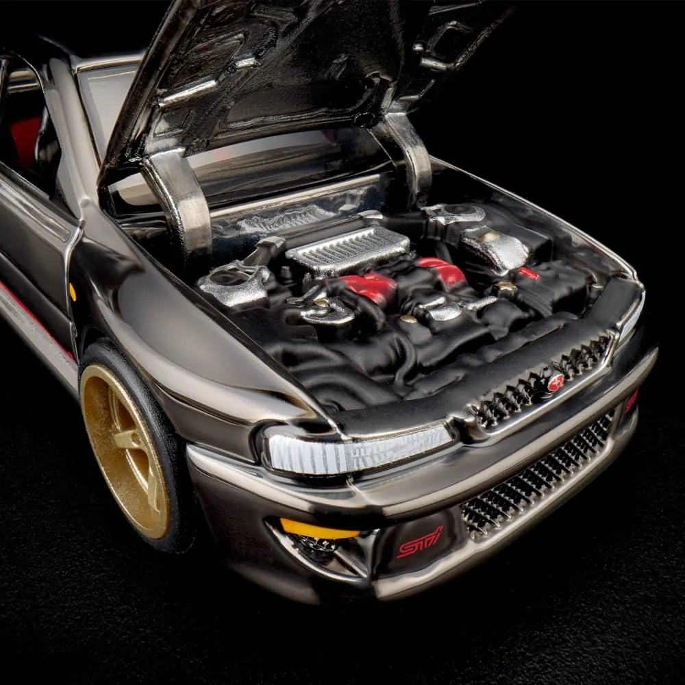 Hot Wheels RLC Exclusive 1998 Subaru Impreza WRX STi 1:64 JJY62 in Spectraflame Slate with pink STi stripes and bronze Real Riders wheels