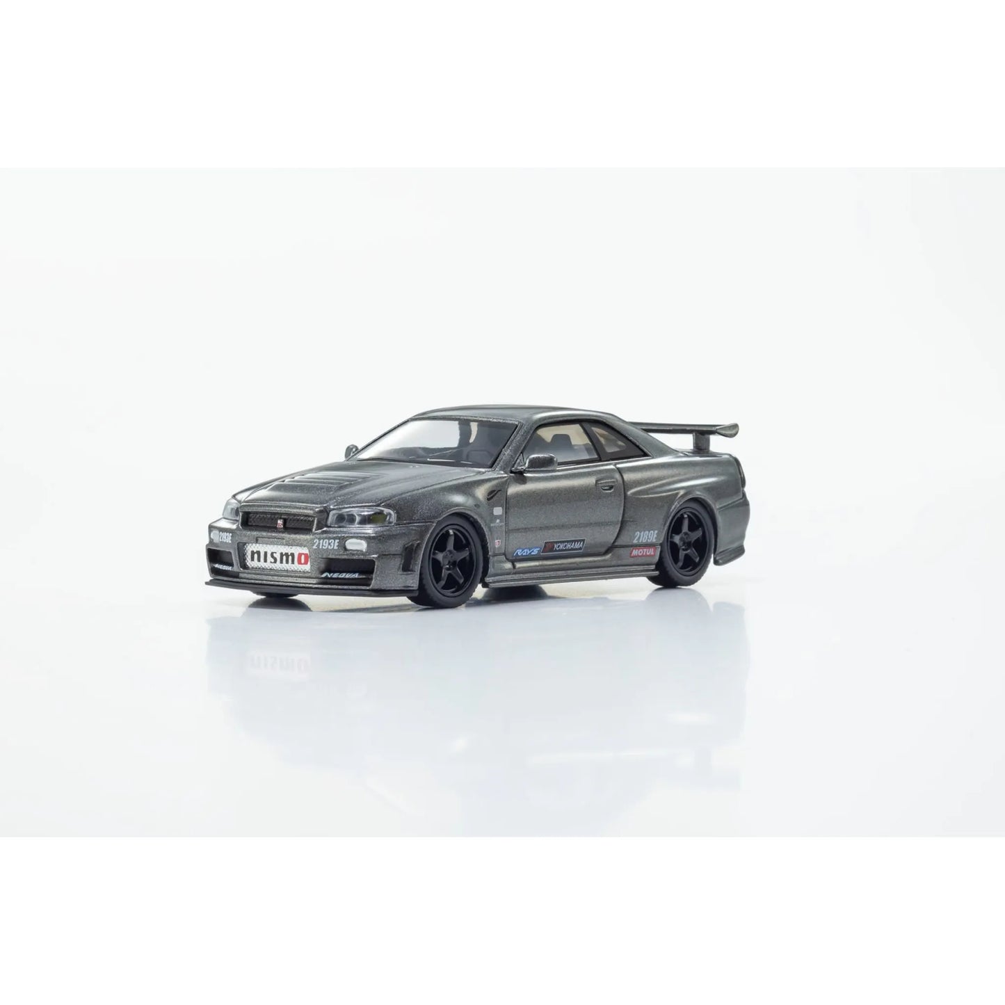 Kyosho 1:64 Nissan Skyline GT-R R34 NISMO BNR34 CRS Version Gray die-cast collectible model.