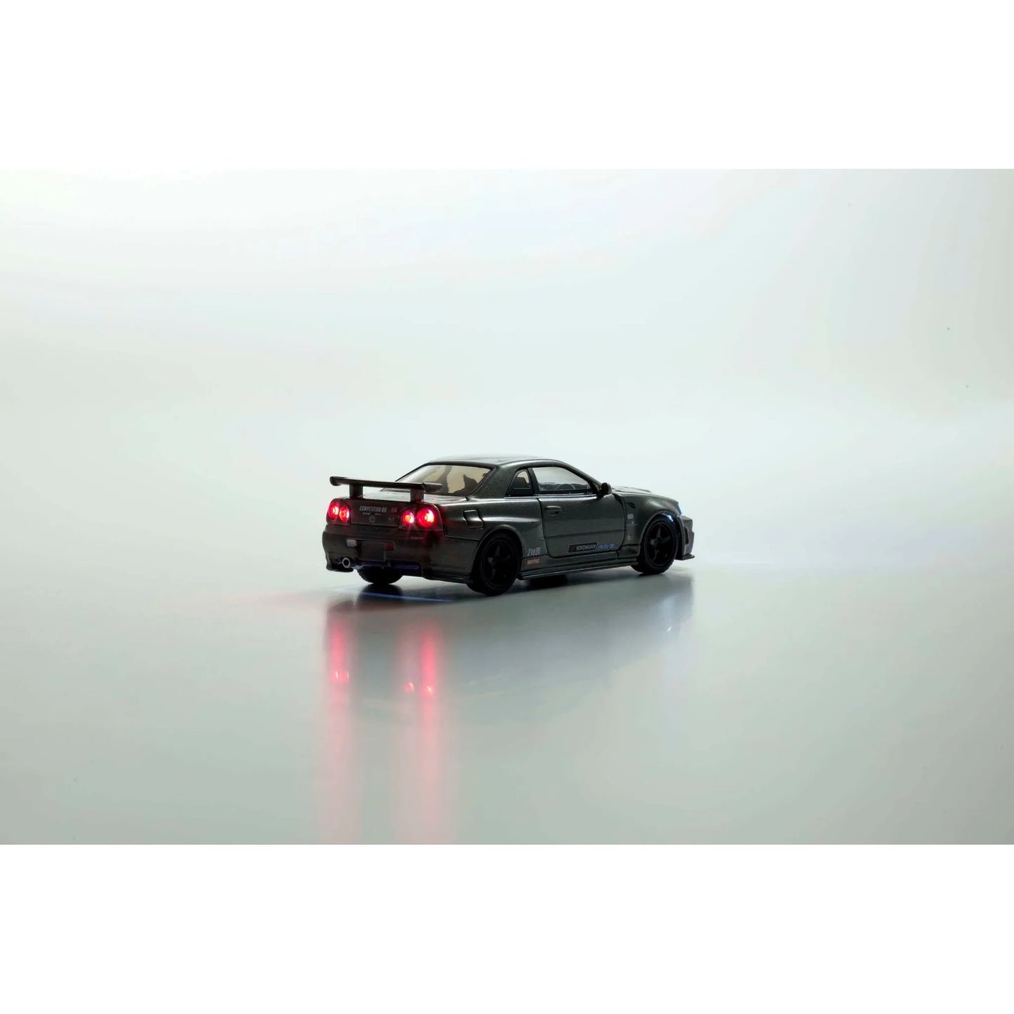 Kyosho 1:64 Nissan Skyline GT-R R34 NISMO BNR34 CRS Version Gray die-cast collectible model.