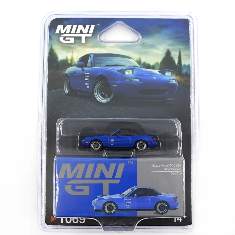 Mini GT 1:64 scale Mazda Miata MX-5 (NA) Tuned Version die-cast model in Dark Blue with LHD and blister packaging.