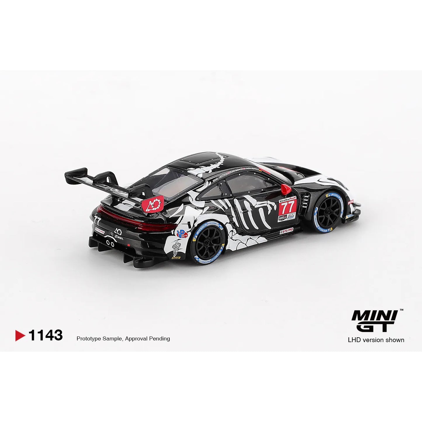 Mini GT 1:64 Porsche 911 GT3 R #77 AO Racing Skeleton Rexy 2025 IMSA Petit Le Mans die-cast model.