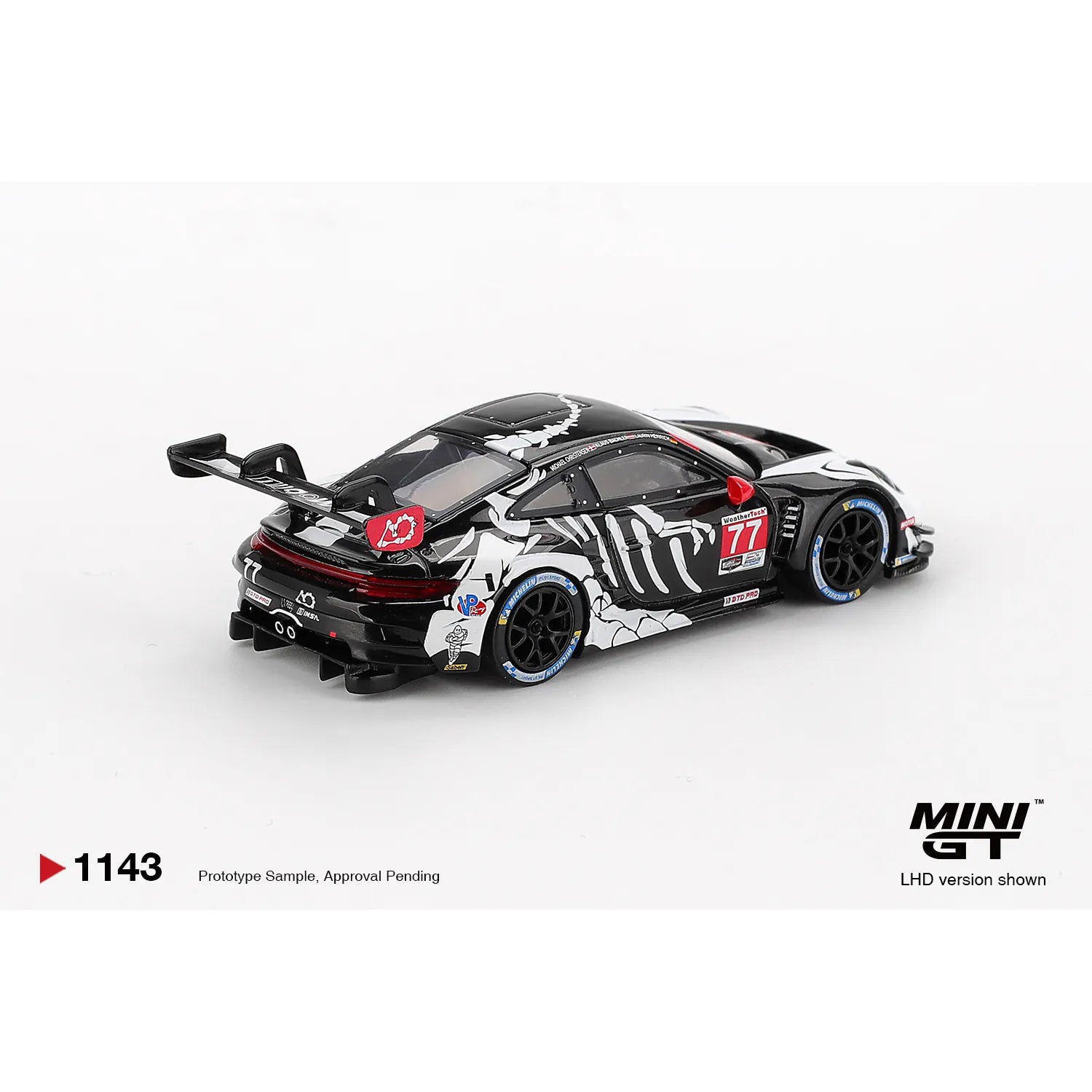 Mini GT 1:64 Porsche 911 GT3 R #77 AO Racing Skeleton Rexy 2025 IMSA Petit Le Mans die-cast model.