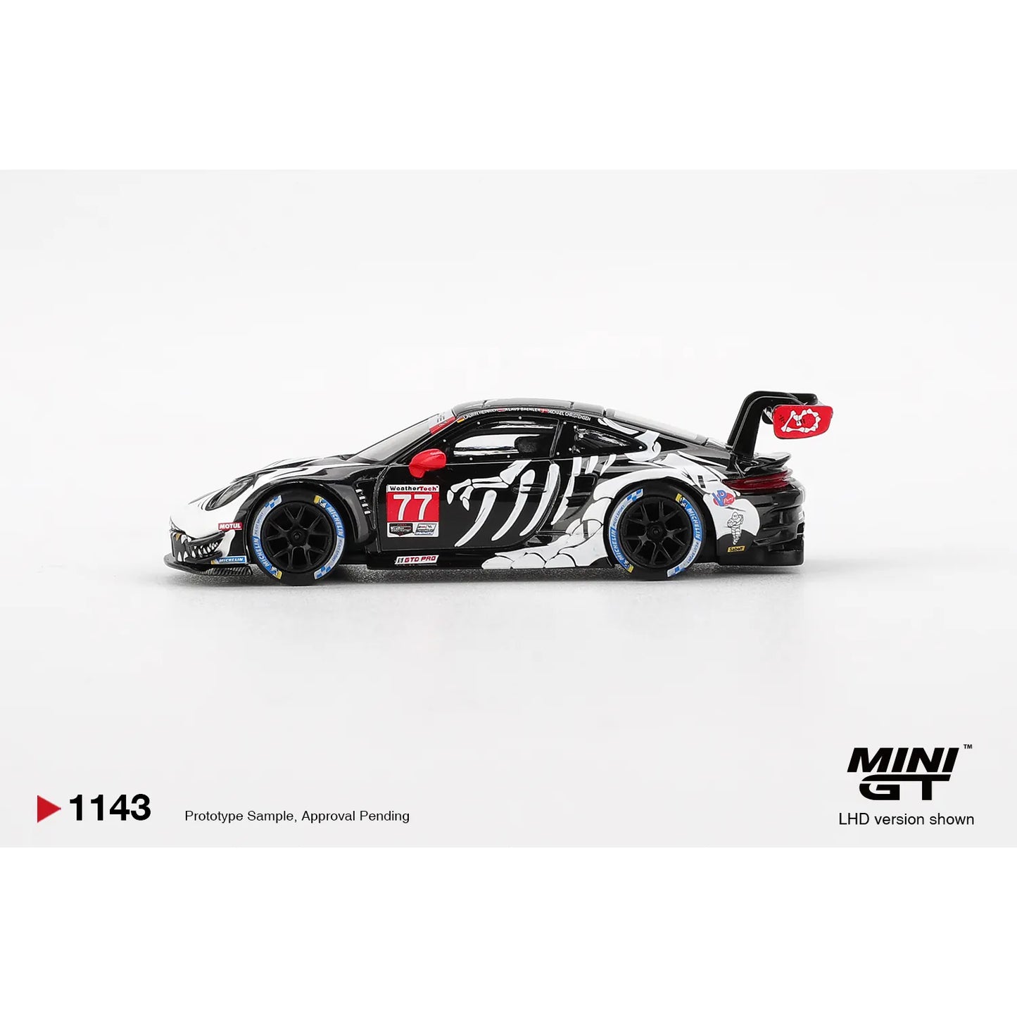 Mini GT 1:64 Porsche 911 GT3 R #77 AO Racing Skeleton Rexy 2025 IMSA Petit Le Mans die-cast model.