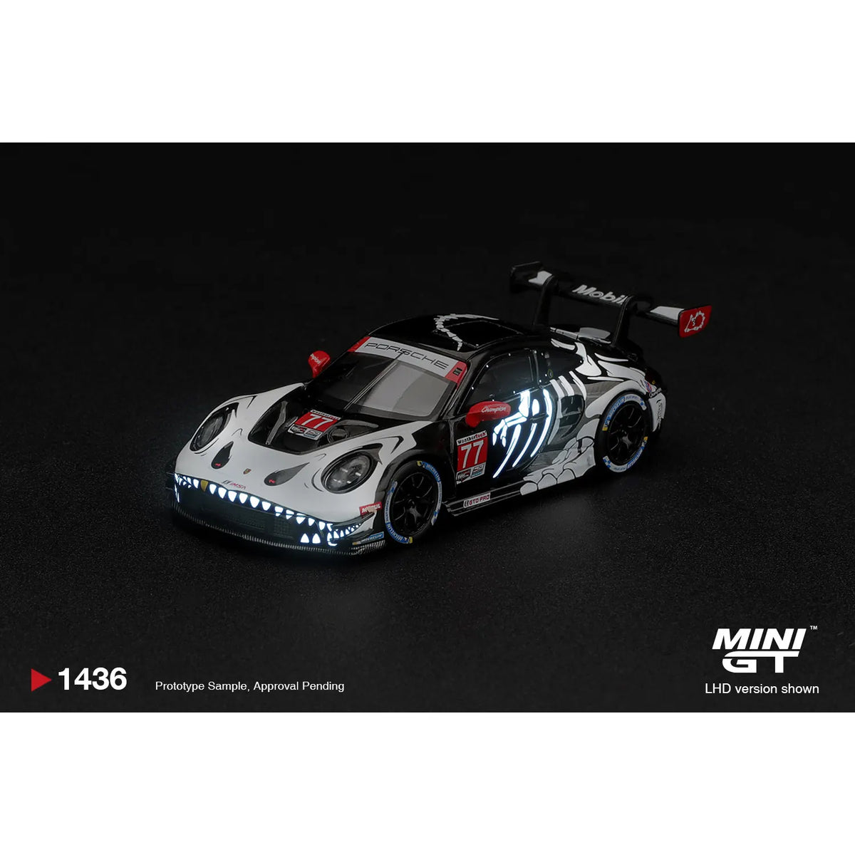 Mini GT 1:64 Porsche 911 GT3 R #77 Rexy boxed MGT01436-L with dinosaur skeleton graphics and glow-style racing livery