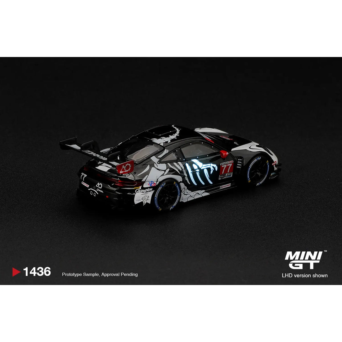 Mini GT 1:64 Porsche 911 GT3 R #77 Rexy boxed MGT01436-L with dinosaur skeleton graphics and glow-style racing livery