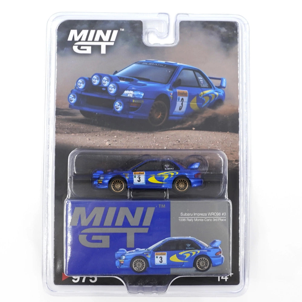 MiniGT 1:64 die-cast Subaru Impreza WRC98 #3 in blue and yellow 1998 Rally Monte Carlo livery with roof rally lights and gold wheels.