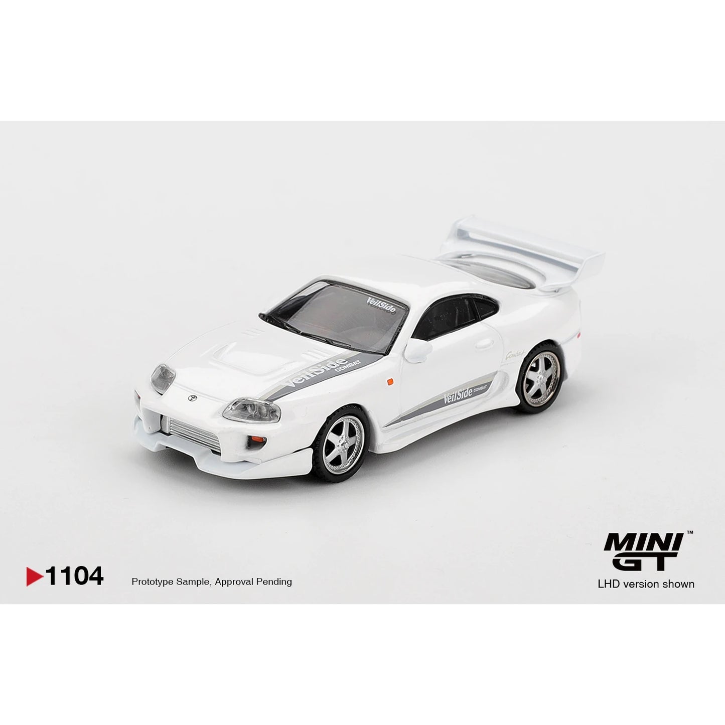 MINI GT 1:64 Toyota Supra VeilSide Combat V-I die-cast model in white.