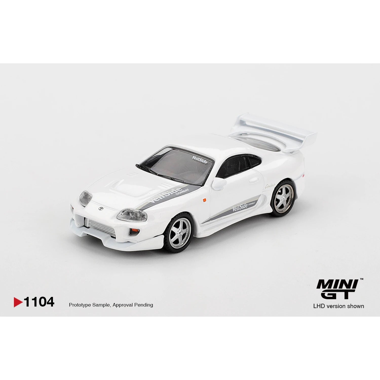 MINI GT 1:64 Toyota Supra VeilSide Combat V-I die-cast model in white.