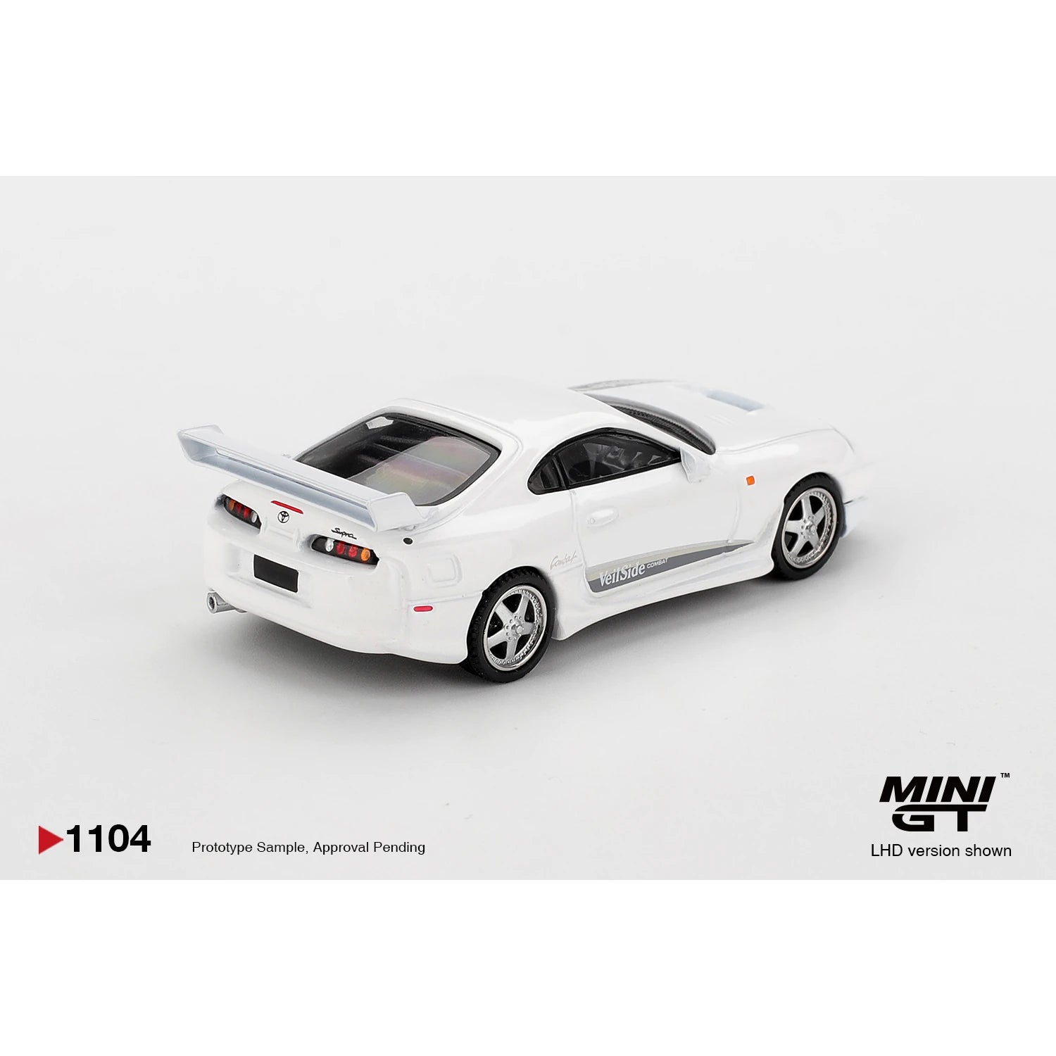 MINI GT 1:64 Toyota Supra VeilSide Combat V-I die-cast model in white.