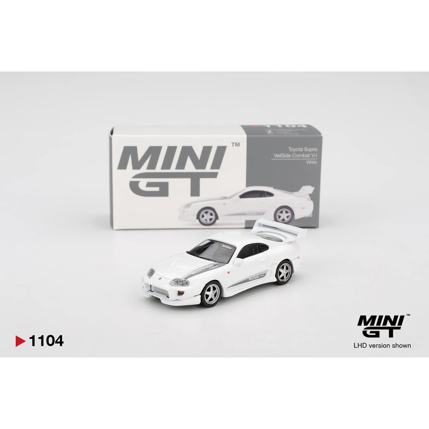 MINI GT 1:64 Toyota Supra VeilSide Combat V-I die-cast model in white.