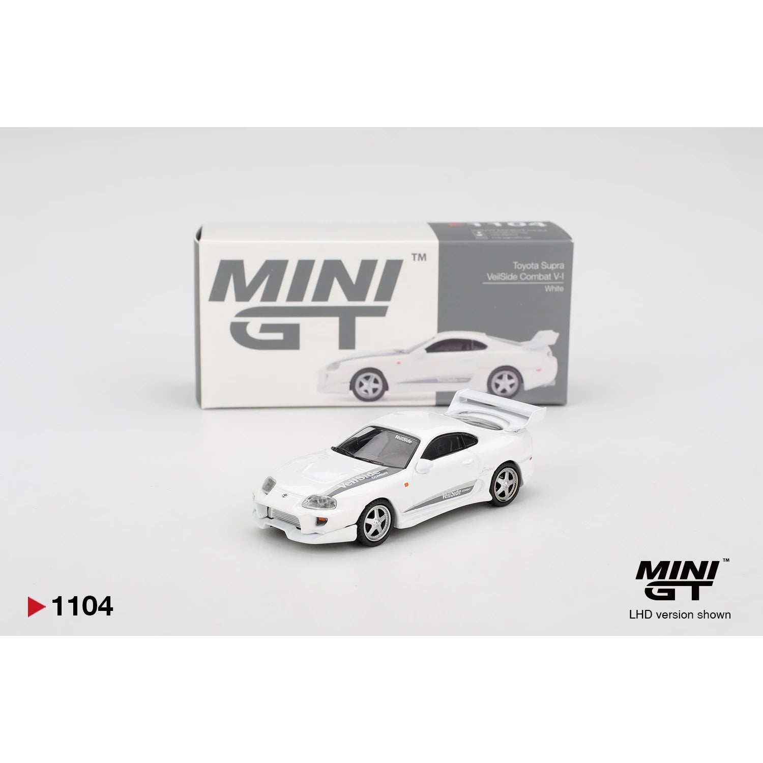 MINI GT 1:64 Toyota Supra VeilSide Combat V-I die-cast model in white.