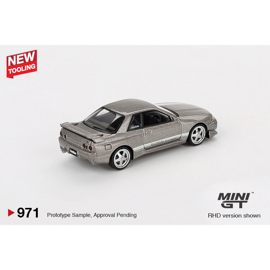 MINI GT 1:64 Nissan Skyline GT-R (R32) VeilSide Combat C-I in Combat Grey — product images showing left profile, three-quarter front and retail blister packaging (product #971).
