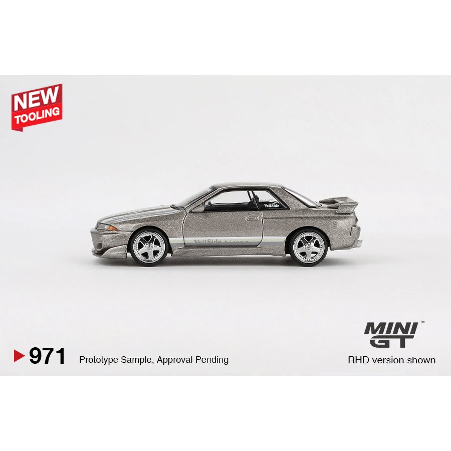 MINI GT 1:64 Nissan Skyline GT-R (R32) VeilSide Combat C-I in Combat Grey — product images showing left profile, three-quarter front and retail blister packaging (product #971).