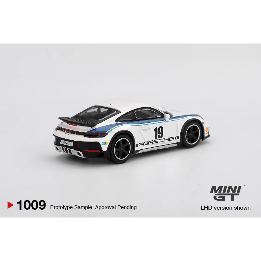 Mini GT 1:64 scale Porsche 911 Dakar Rally 1974 White #1009 MGT01009 die-cast model with number 19 rally graphics.