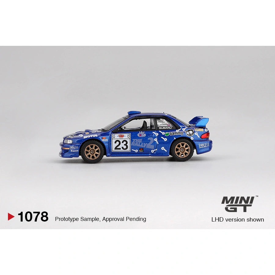 Mini GT 1:64 Subaru Impreza WRC99 #23 from the 2000 Acropolis Rally featuring rally-style livery, authentic WRC detailing, and rugged die-cast finish