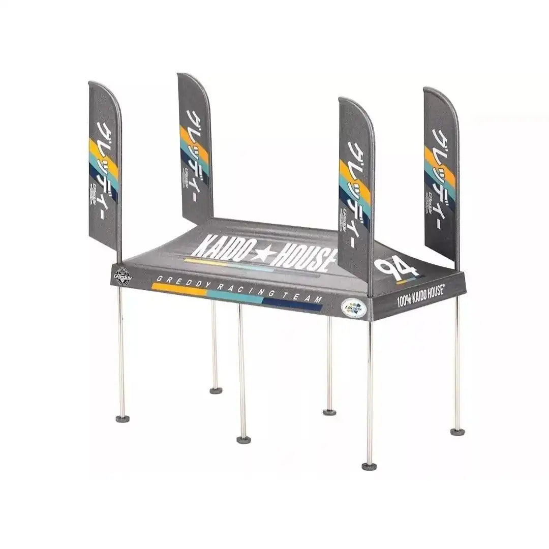 MiniGT Kaido House GReddy V1 Paddock Service Tent Set with Kaido House branding and bonus wheels, scale accessory for die-cast displays.